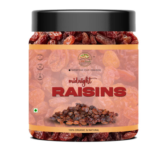 Plump black midnight raisins in wooden bowl