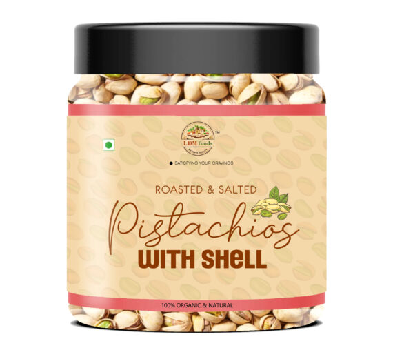 Fresh pistachios with half-open shells in bowl