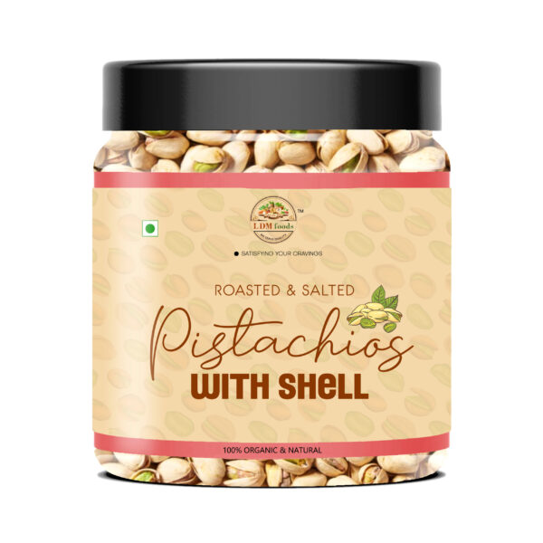 Fresh pistachios with half-open shells in bowl